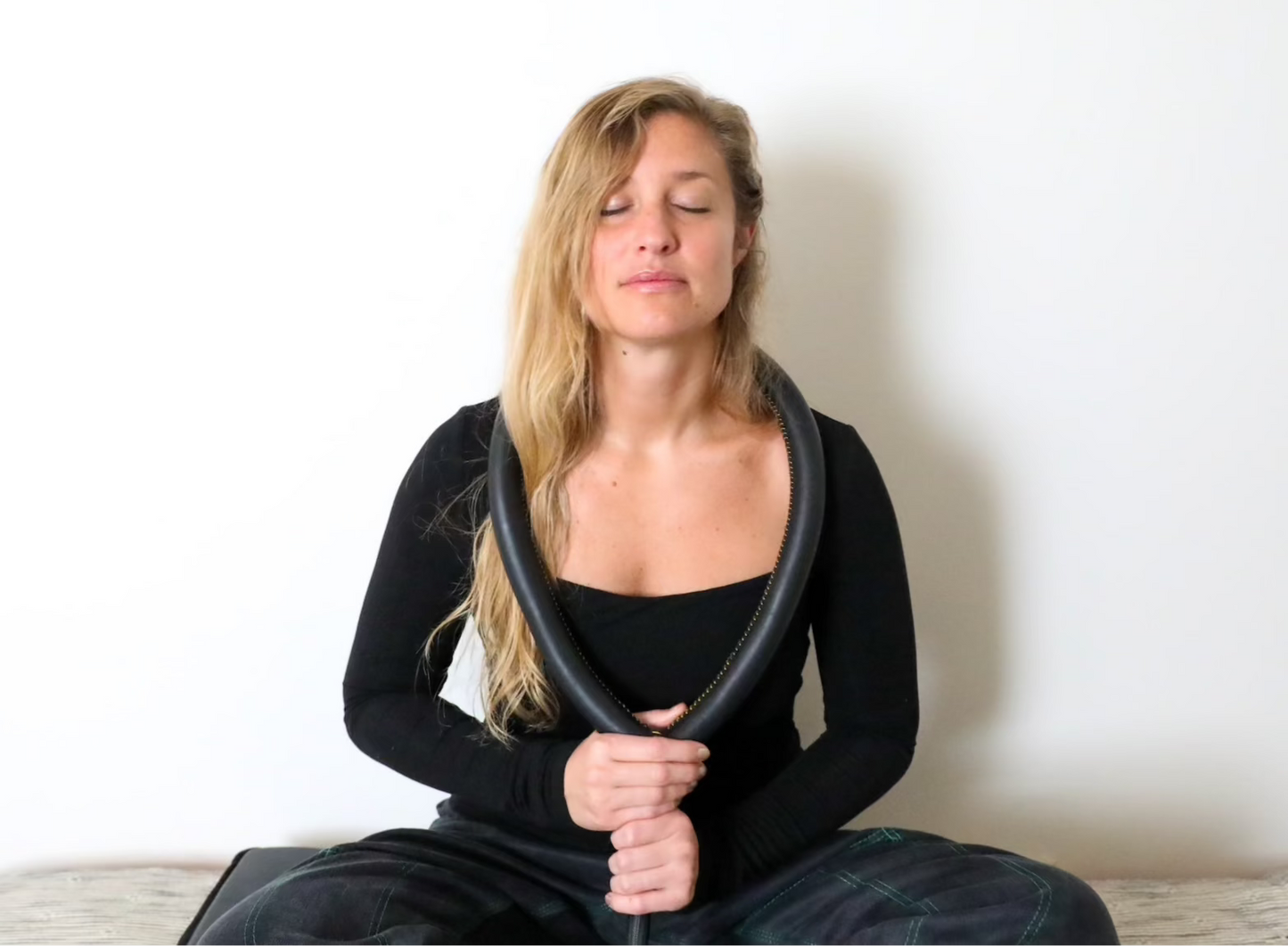 ARC PEMF Large Loop Applicator around a woman's neck