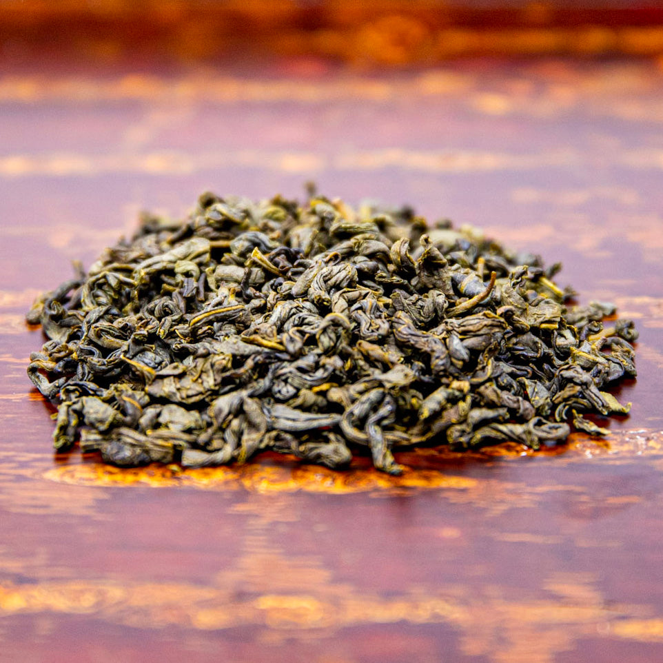 Aged Chrysanthemum and Jasmine Green Tea is piled on a wooden tray serving tray