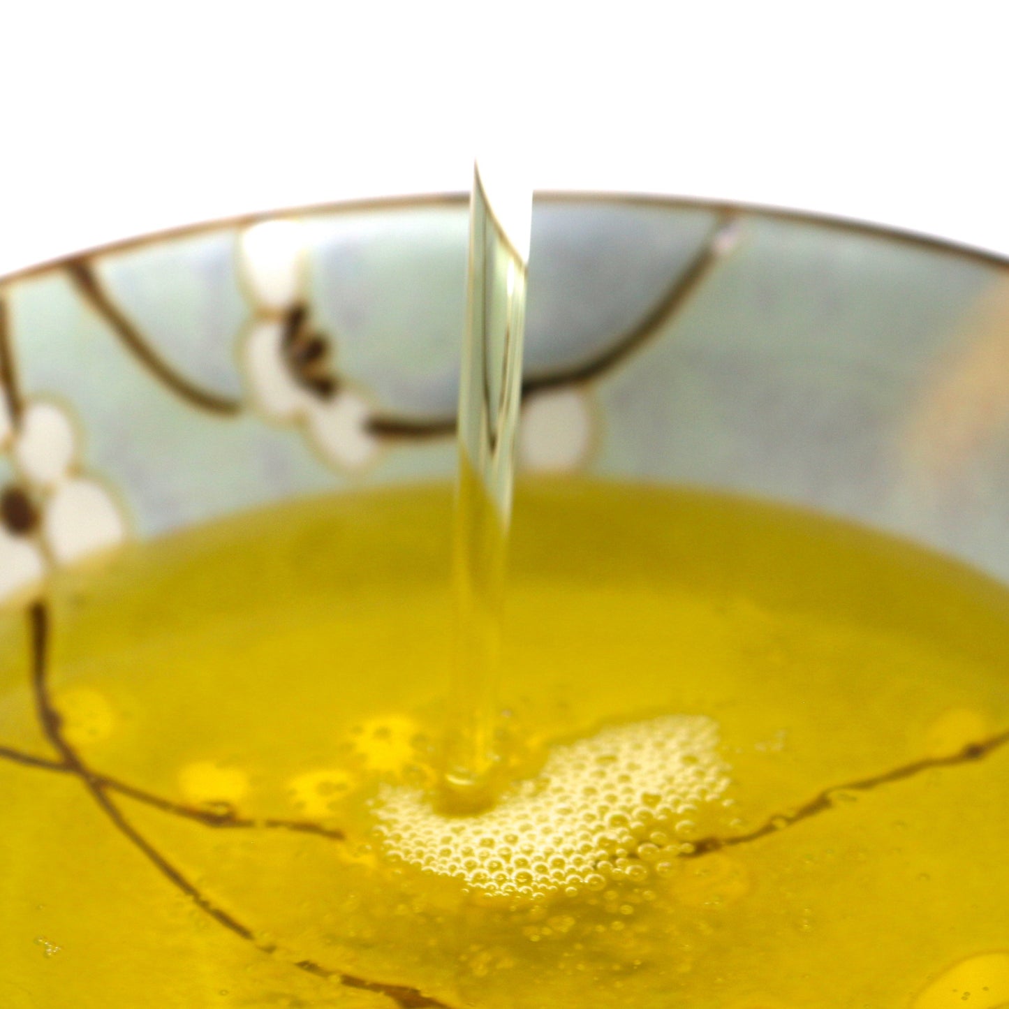 This is a  close up picture of Shen Blossom's Gobo Root Oil in bowl