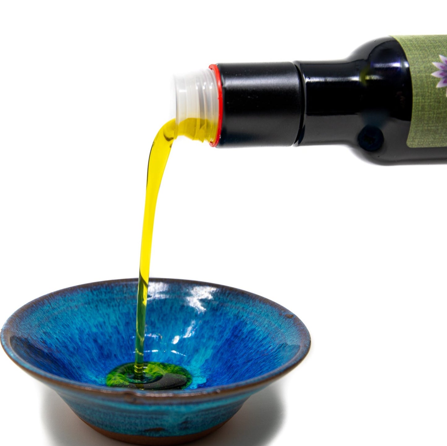 ShenBlossom Pure Olive Oil being poured into bowl