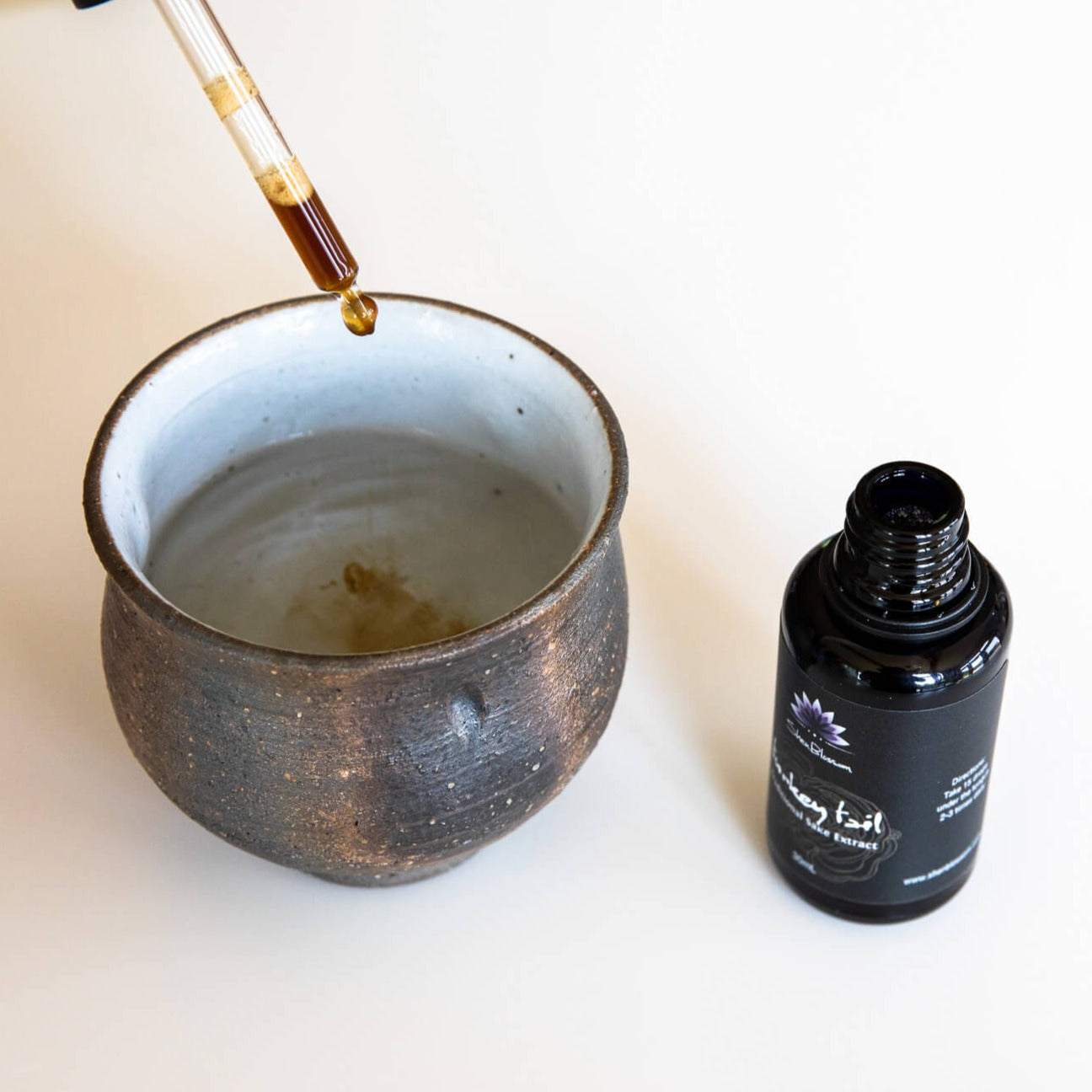 Turkey Tail extract being placed in hot water
