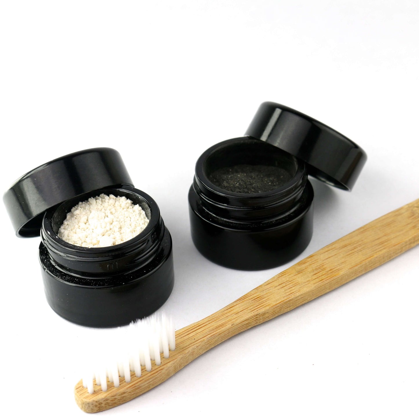 Shen Blossom's Tooth Care System photographed on a white background next to a toothbrush