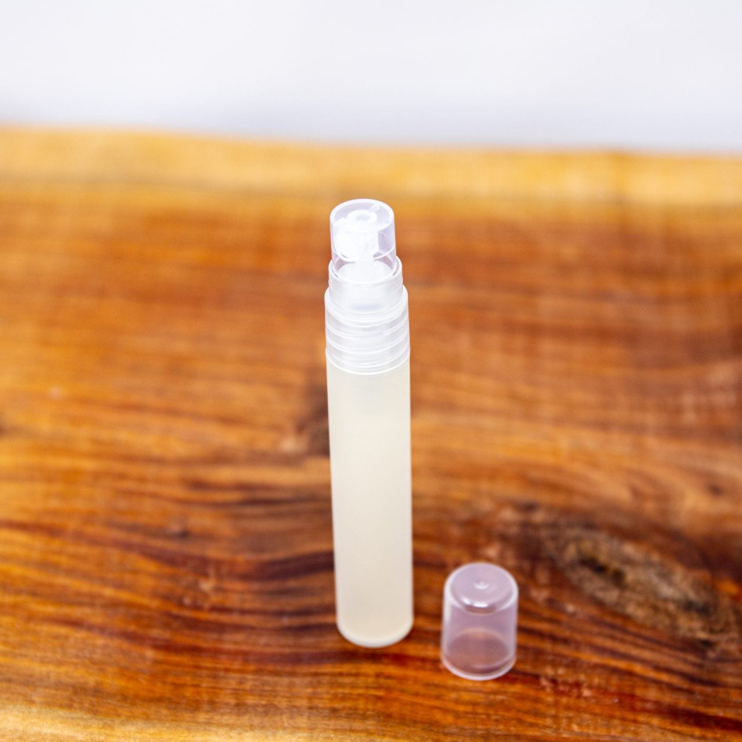 Shen Blossom's Sanity Hand Sanitizer sits on a wooden serving tray