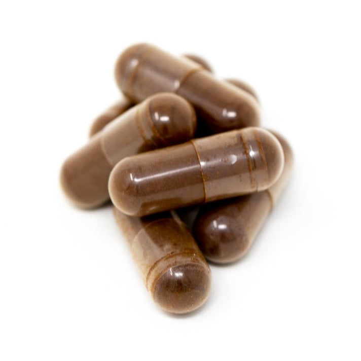 Shen Blossom's Wild Red Reishi Mushroom Full Spectrum Powder capsules photographed on a white background
