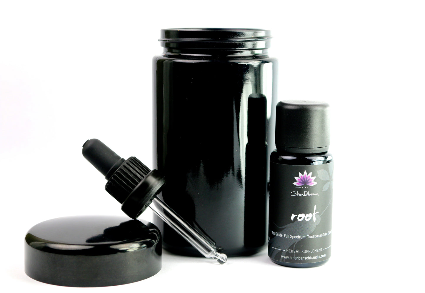 Shen Blossom's Root Ginseng extract and dropper photographed on a white background