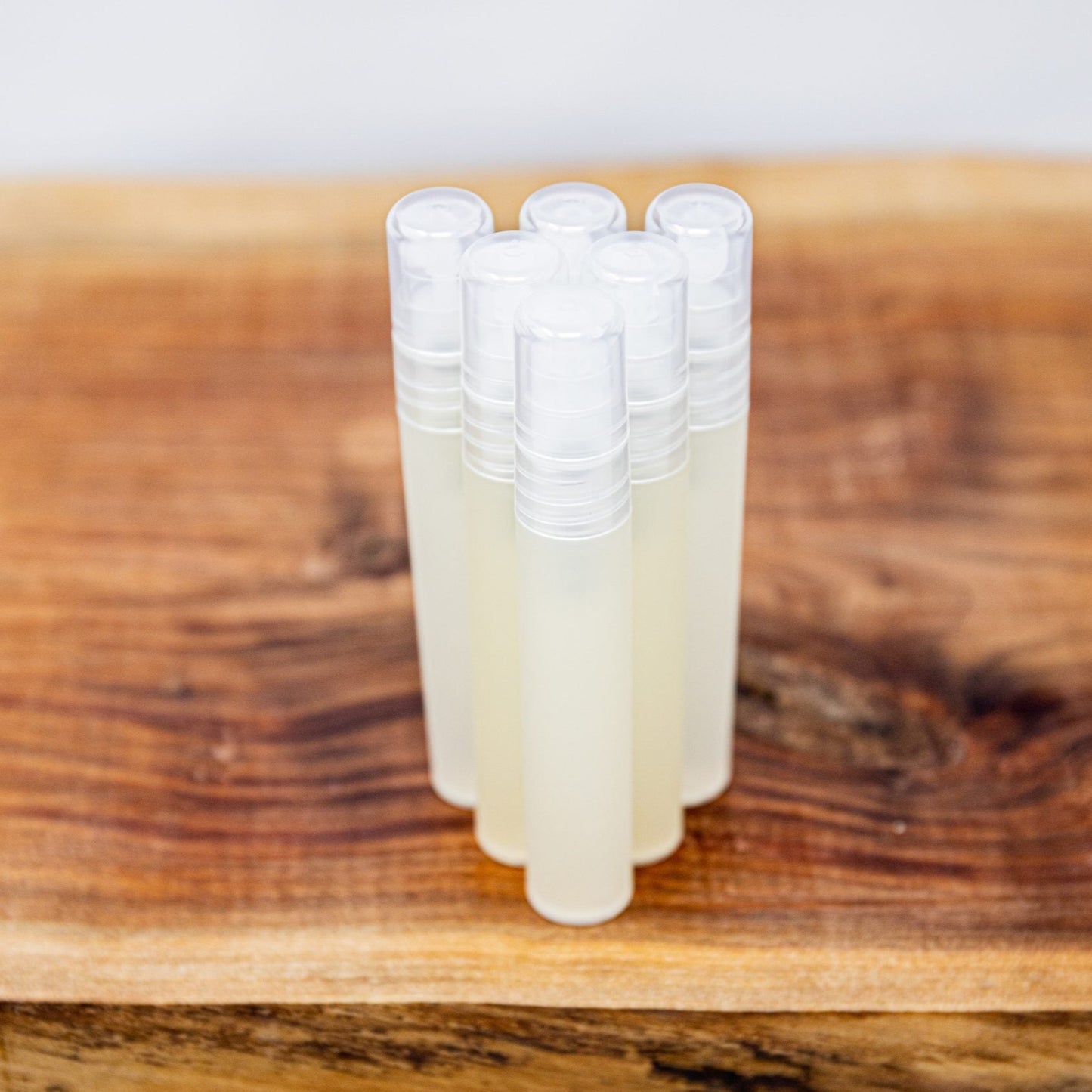 Group of Sanity Hand Sanitizers photographed on a wooden serving tray