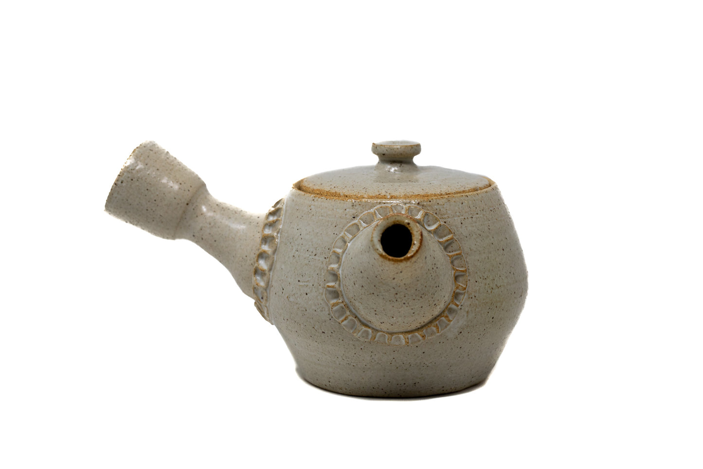 A white tea pot photographed on a white background