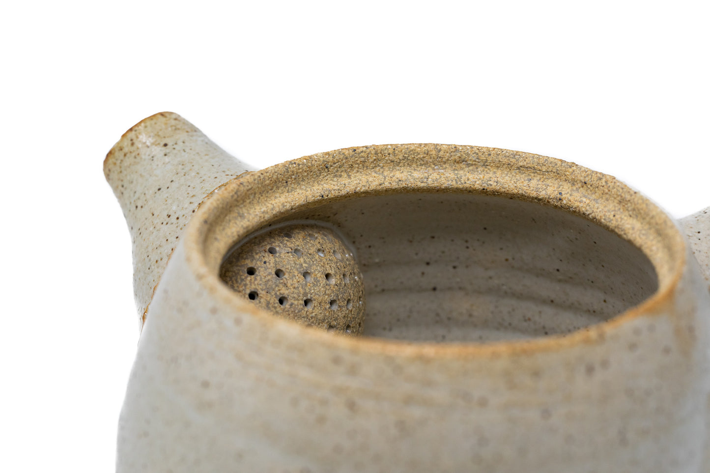 A white tea pot photographed on a white background
