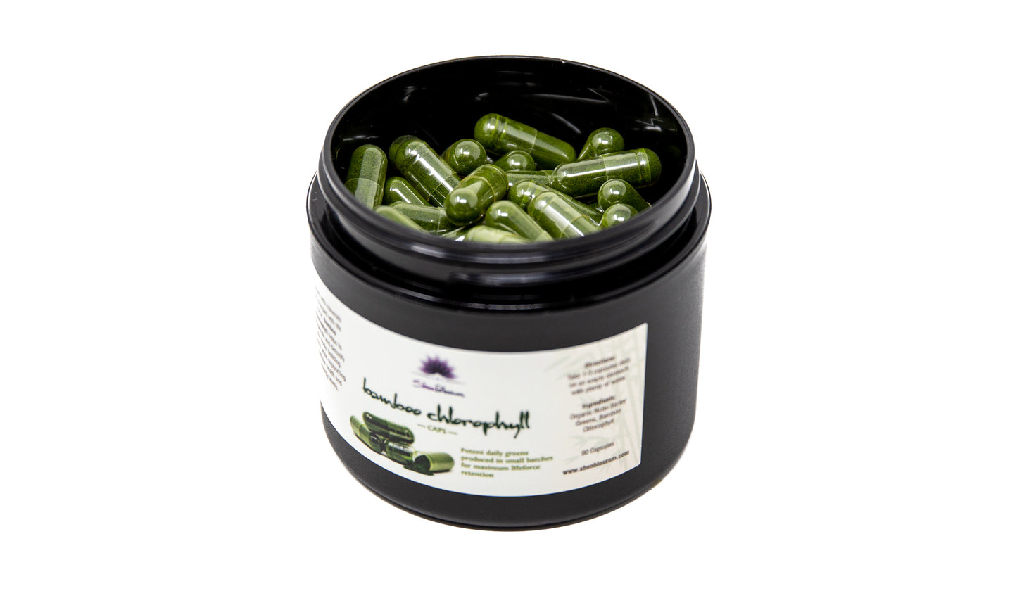 These are Bamboo Chlorophyll capsules  inside of their Shen Blossom bottle photographed on a white background