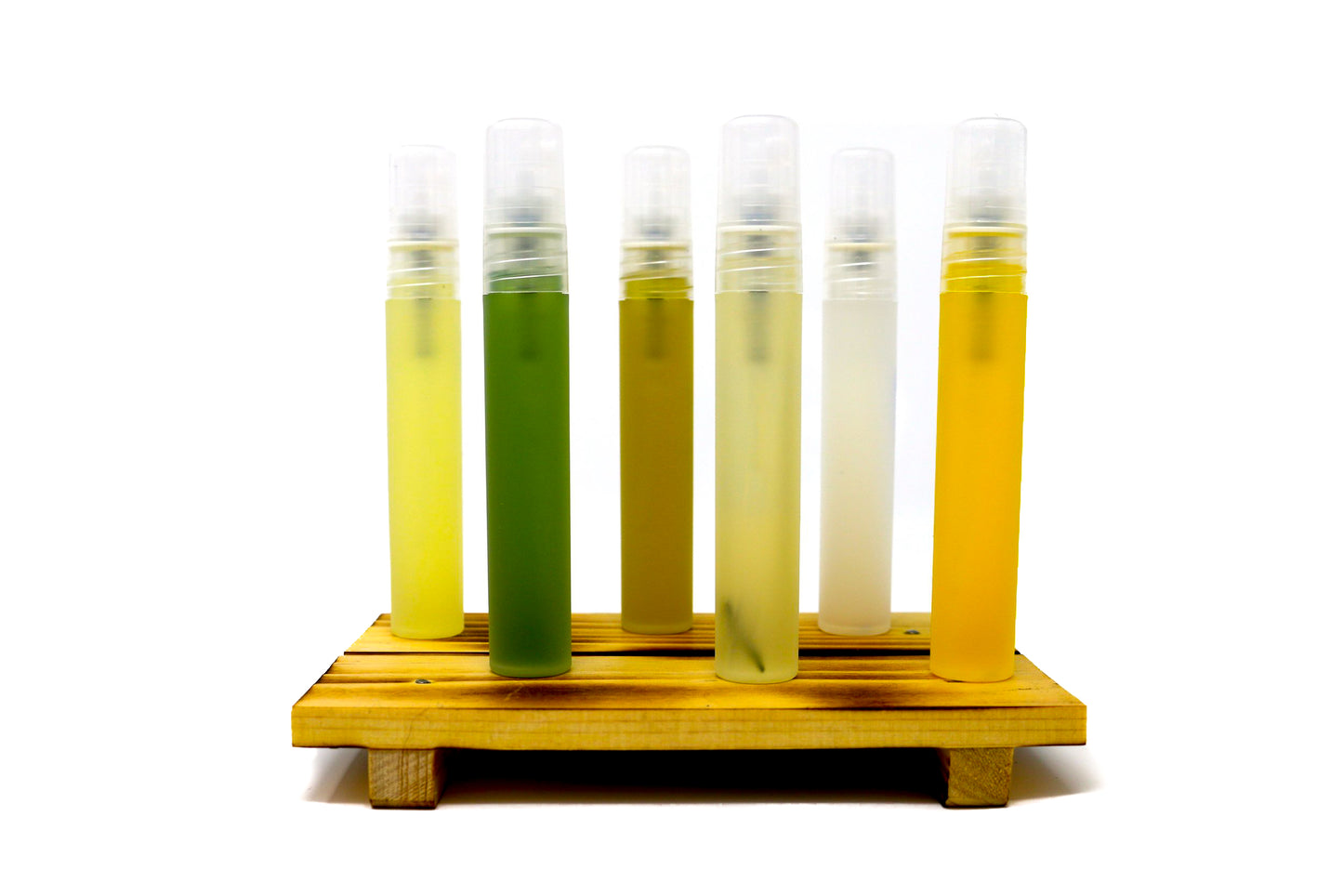 Shen Blossom's Branch Face Serum varieties standing on a wooden serving tray