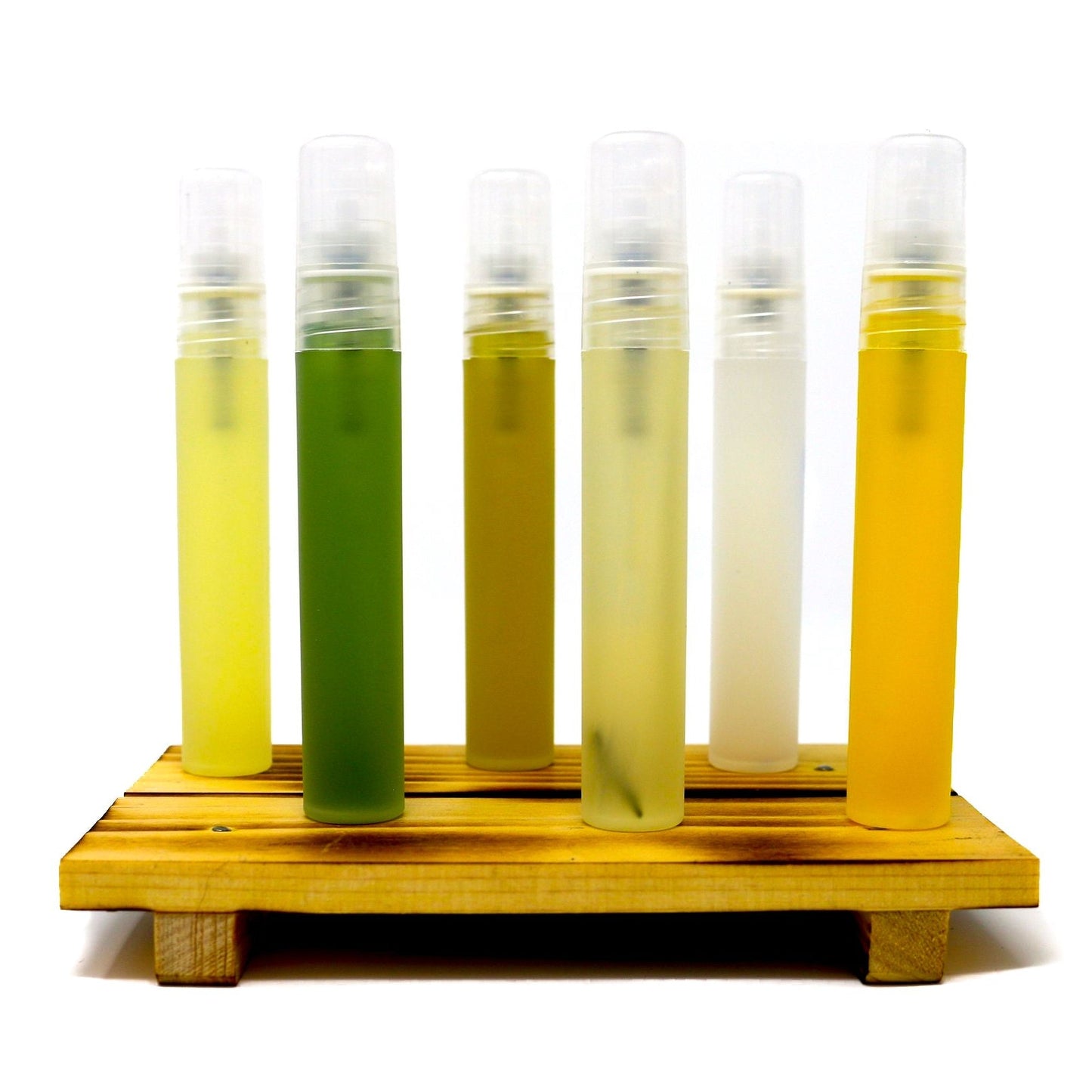 Shen Blossom's Branch Face Serum varieties standing on a wooden serving tray