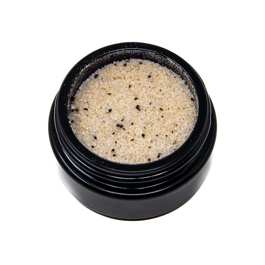A top down photograph showing the contents inside a jar of Shen Blossom's Tri-Mushroom Salt