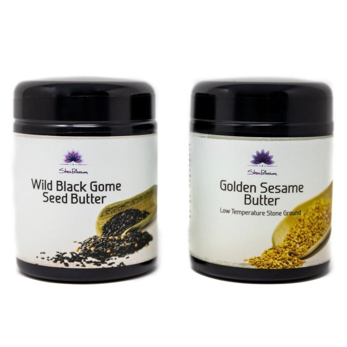 An up close look at Shen Blossom's Wild Black Gome Seed Butter and Golden Sesame Butter photographed on a white background