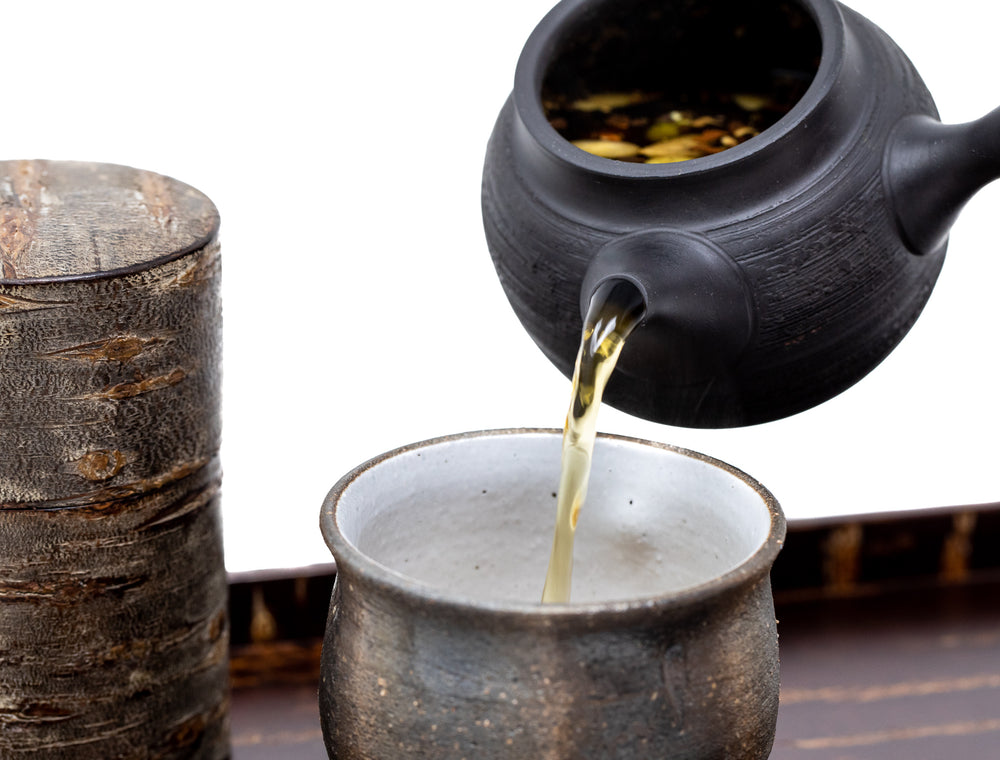 Brewed chai tea being poured into cup